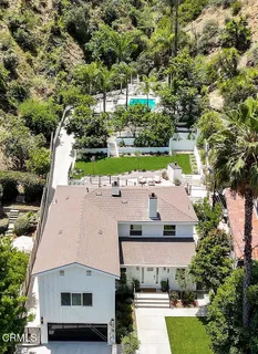 a aerial view of a house with a yard