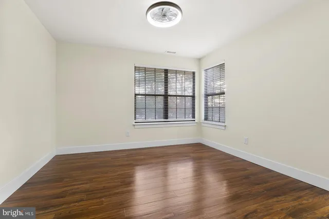 a bedroom with bed and a window