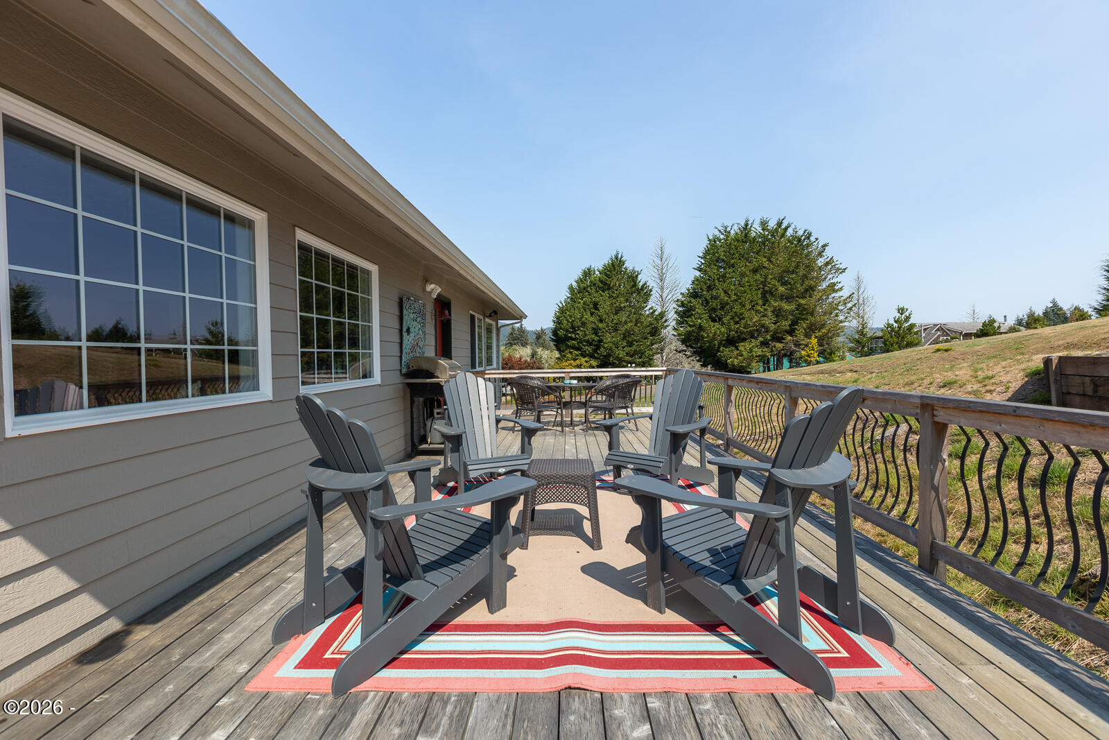 6905 Northeast Highland Road Otis, OR 97368 - Photo 65 of 76 a view of a deck with wooden floor and seating space