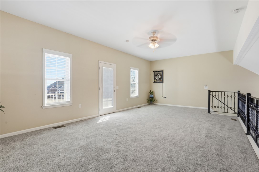 202 C-1-231 Pelzer, SC 29669 - Photo 13 of 49 This spacious bonus room features soft carpeting and ample natural light, perfect for recreation or relaxation.