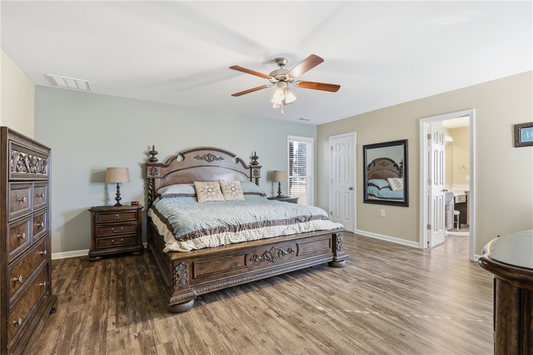 202 C-1-231 Pelzer, SC 29669 - Photo 14 of 49 This spacious bedroom offers ample comfort and direct access to a private bathroom.