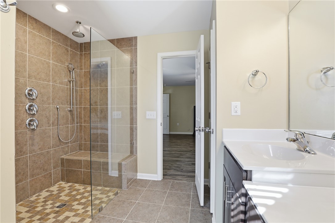 202 C-1-231 Pelzer, SC 29669 - Photo 17 of 49 This bathroom features a contemporary shower and a sleek vanity, offering modern comfort and design.