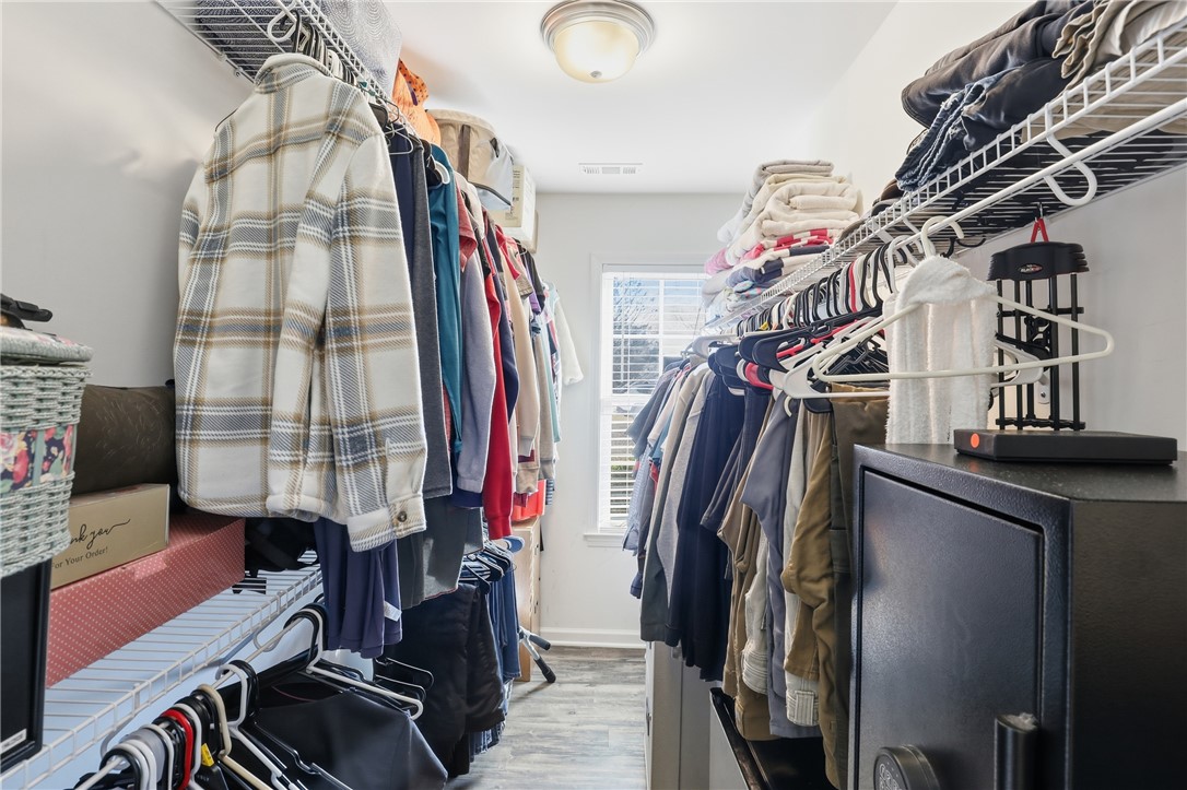 202 C-1-231 Pelzer, SC 29669 - Photo 18 of 49 This organized walk-in closet offers abundant storage, enhancing daily routines.