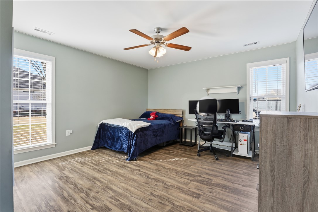 202 C-1-231 Pelzer, SC 29669 - Photo 22 of 49 This spacious bedroom offers ample natural light and a comfortable, relaxed atmosphere.