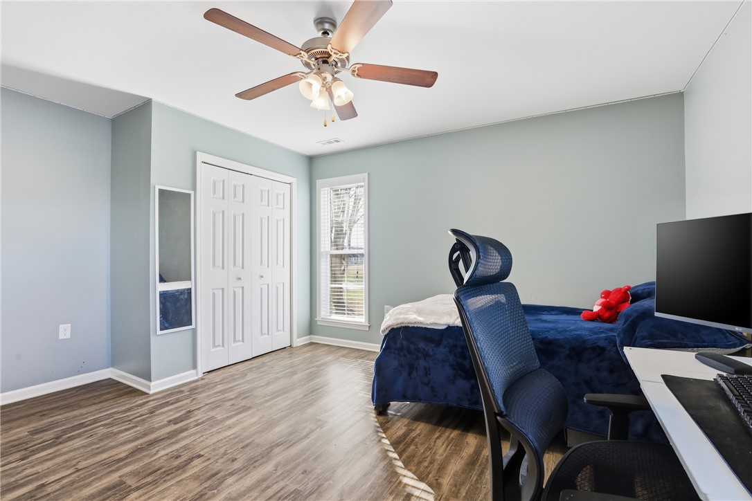 202 C-1-231 Pelzer, SC 29669 - Photo 23 of 49 This cozy bedroom features durable flooring and a bright window, creating a serene living space.