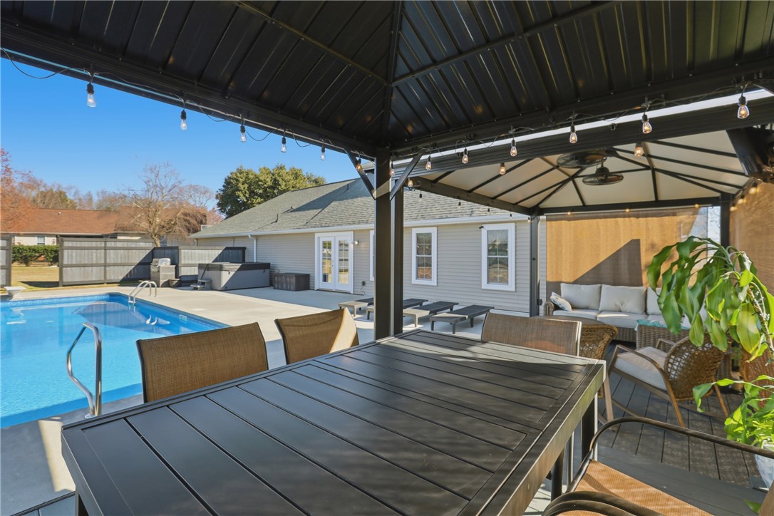 202 C-1-231 Pelzer, SC 29669 - Photo 28 of 49 This private outdoor oasis features a refreshing pool, ample seating, and a covered patio perfect for entertaining.