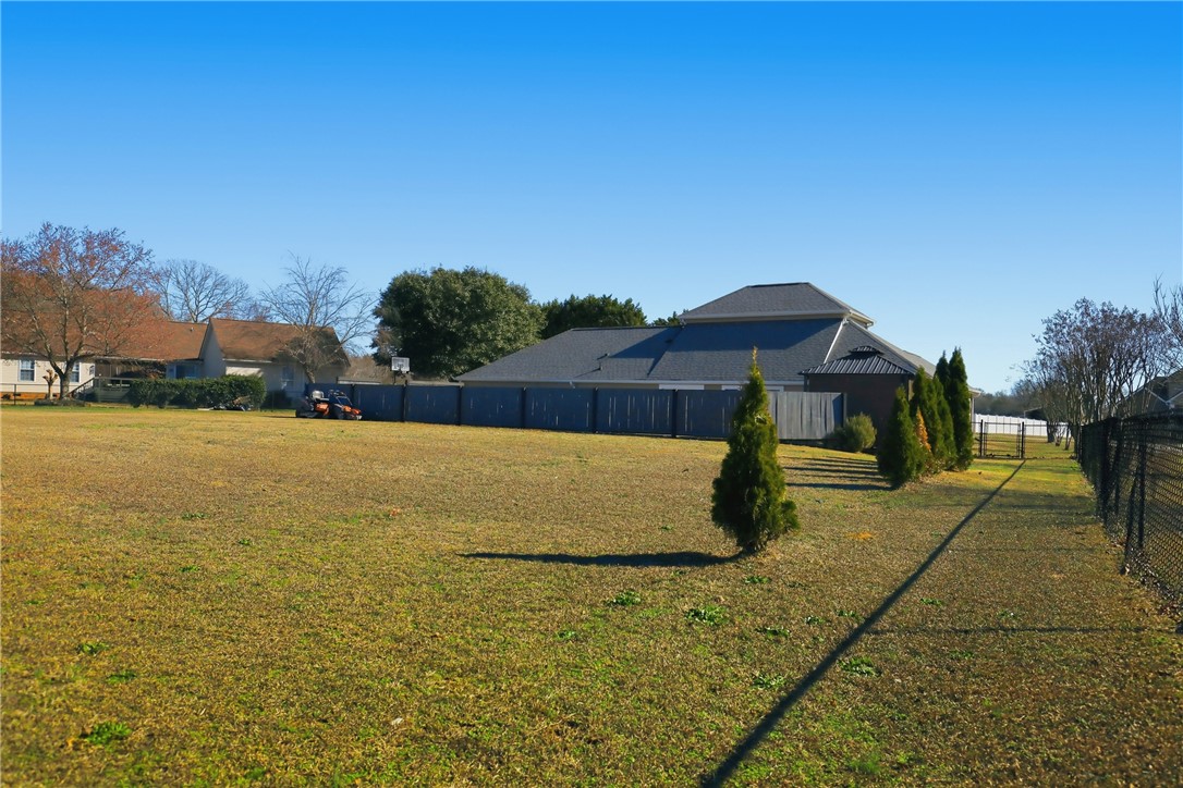 202 C-1-231 Pelzer, SC 29669 - Photo 33 of 49 Expansive green space offers potential for diverse outdoor enjoyment and landscaping.