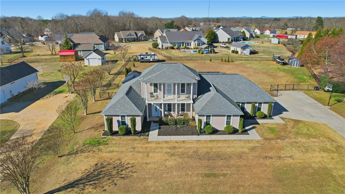 202 C-1-231 Pelzer, SC 29669 - Photo 38 of 49 This spacious home boasts a charming front balcony and a large fenced yard, ideal for outdoor enjoyment.