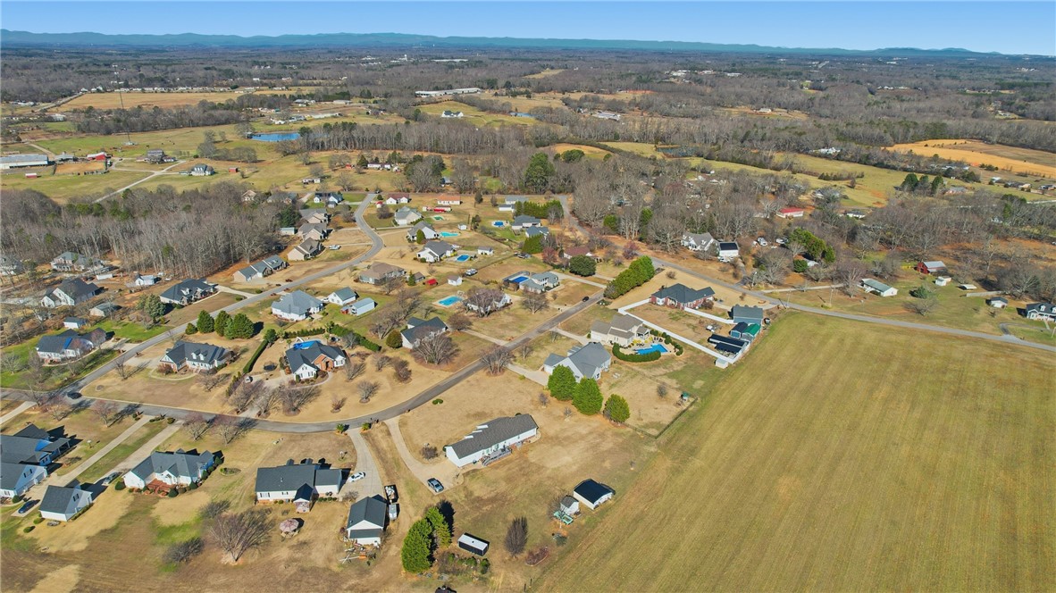 202 C-1-231 Pelzer, SC 29669 - Photo 43 of 49 An aerial perspective reveals a serene community nestled amidst rolling hills and lush landscapes.