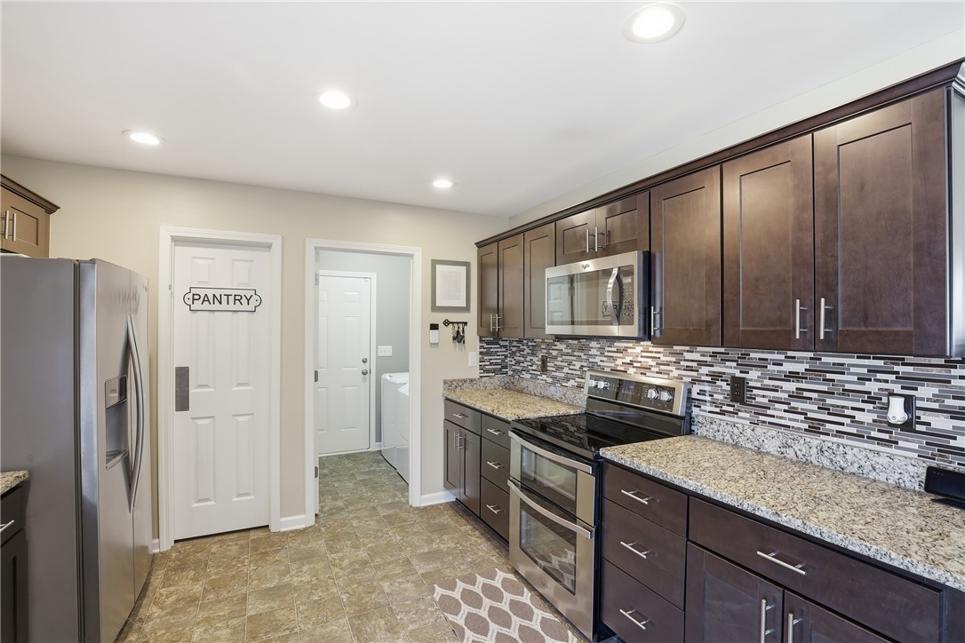 202 C-1-231 Pelzer, SC 29669 - Photo 9 of 49 This functional kitchen features ample storage and modern appliances.