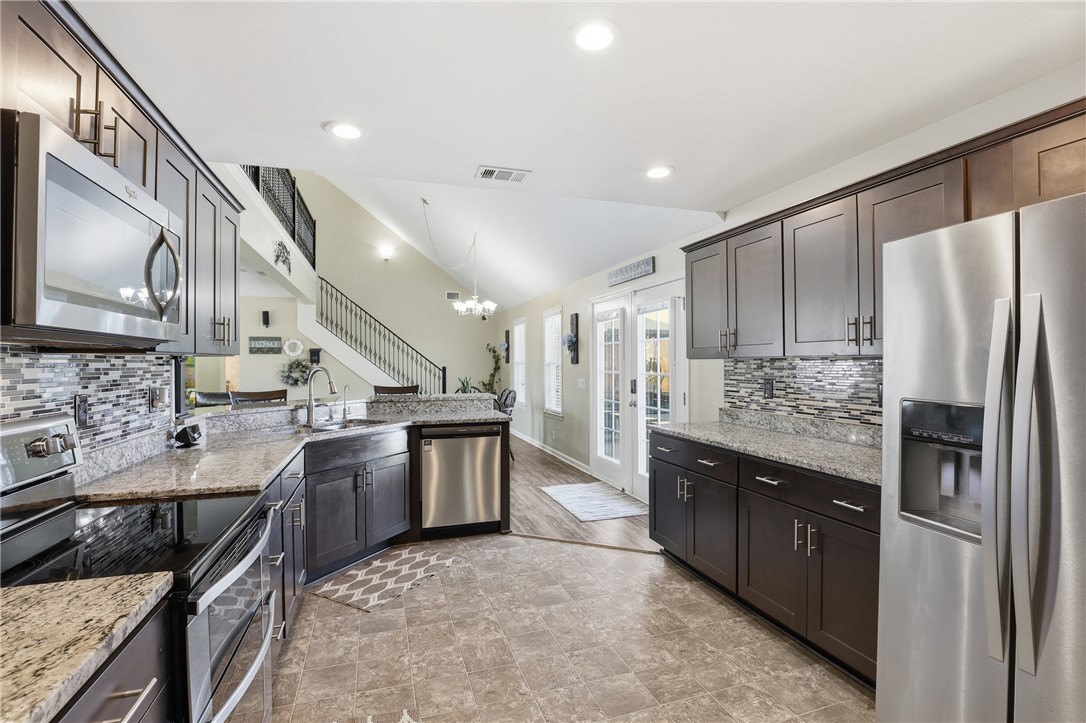 202 C-1-231 Pelzer, SC 29669 - Photo 49 of 49 This kitchen features stainless steel appliances, granite countertops, and an open floorplan with high ceilings.