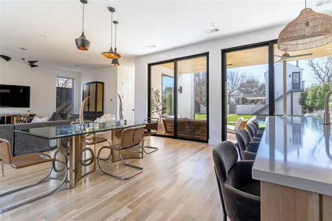 a very nice looking living room with a large window and furniture