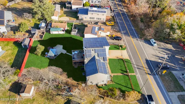 an aerial view of houses with outdoor space