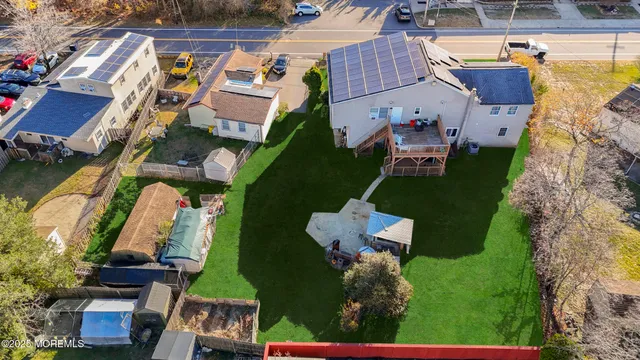 an aerial view of houses with yard