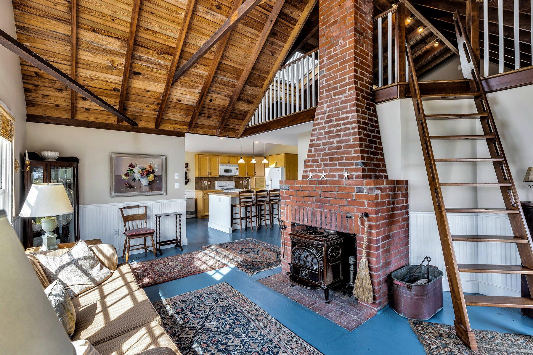 6 Bay View Path Truro, MA 02666 - Photo 14 of 57 a living room with furniture and a fireplace
