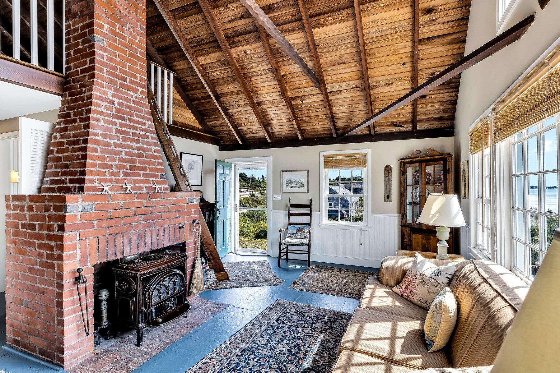 6 Bay View Path Truro, MA 02666 - Photo 15 of 57 a living room with furniture and a fireplace
