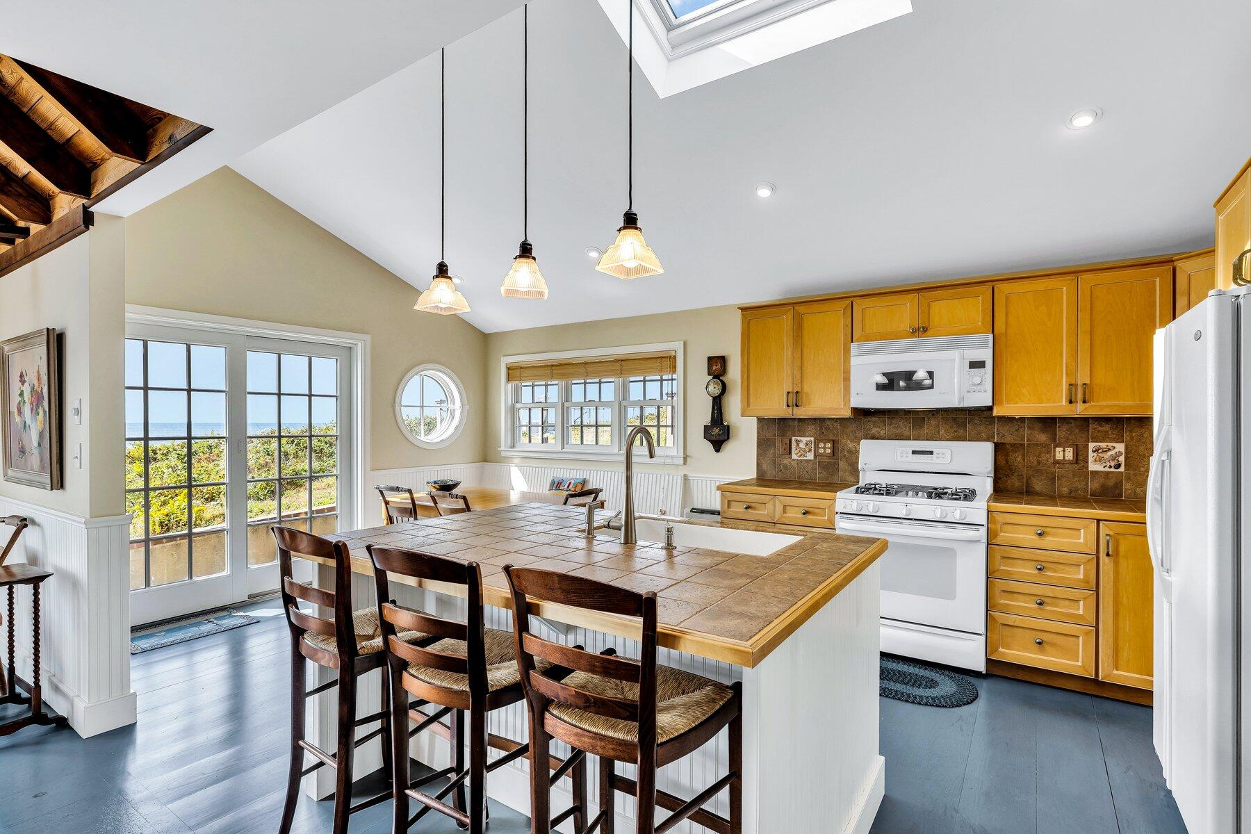 6 Bay View Path Truro, MA 02666 - Photo 16 of 57 a view of a dining room with furniture window and wooden floor