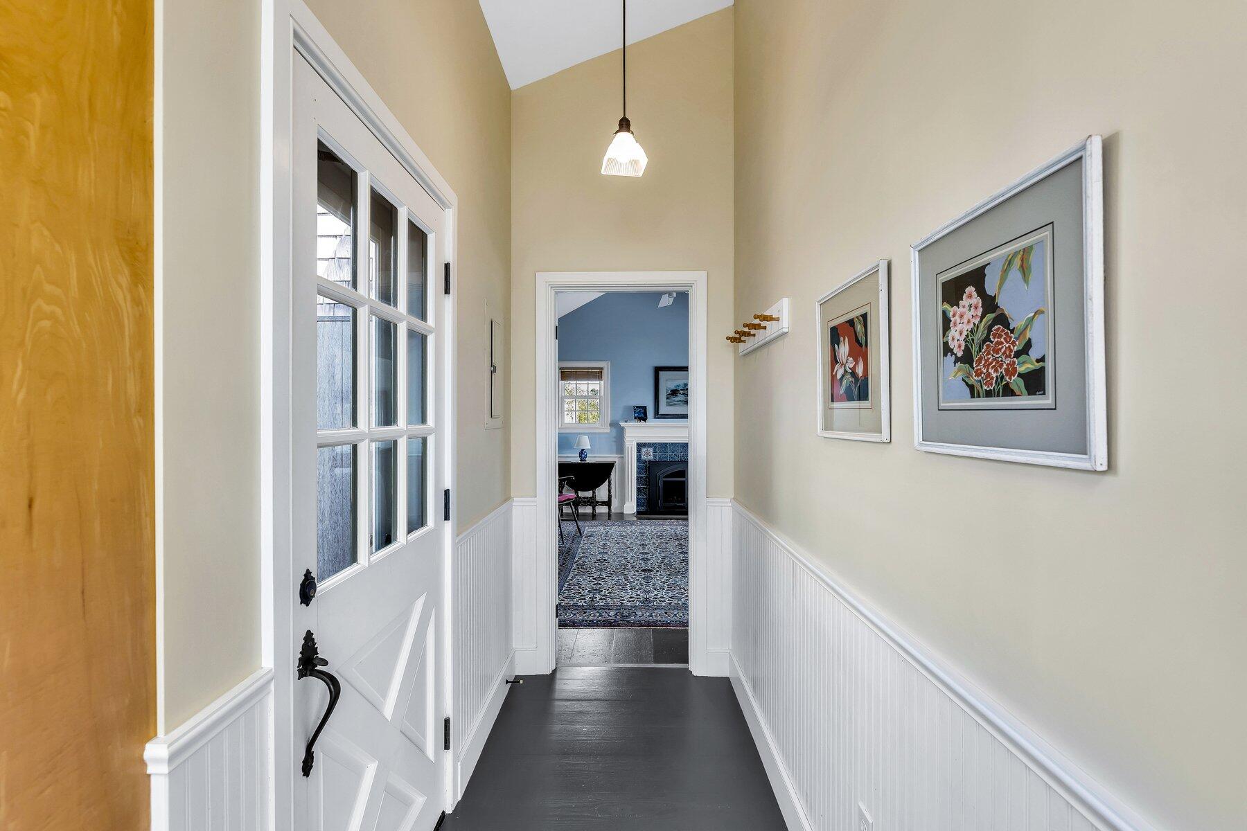 6 Bay View Path Truro, MA 02666 - Photo 18 of 57 a view of a hallway with wooden floor and dining room