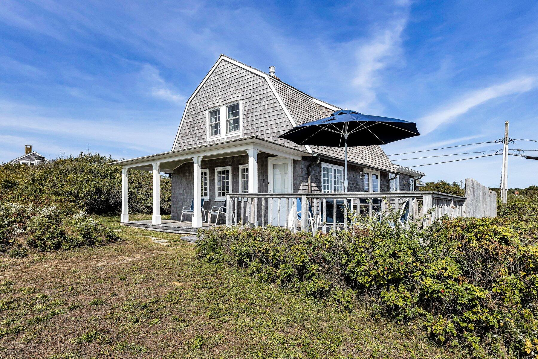 6 Bay View Path Truro, MA 02666 - Photo 27 of 57 a front view of a house with a garden