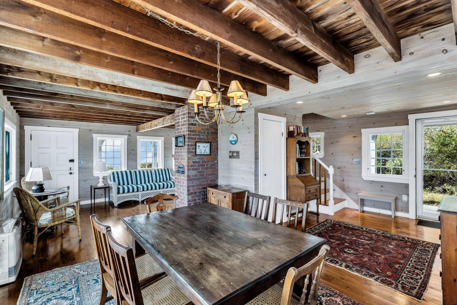 6 Bay View Path Truro, MA 02666 - Photo 35 of 57 a dining room with furniture window and wooden floor