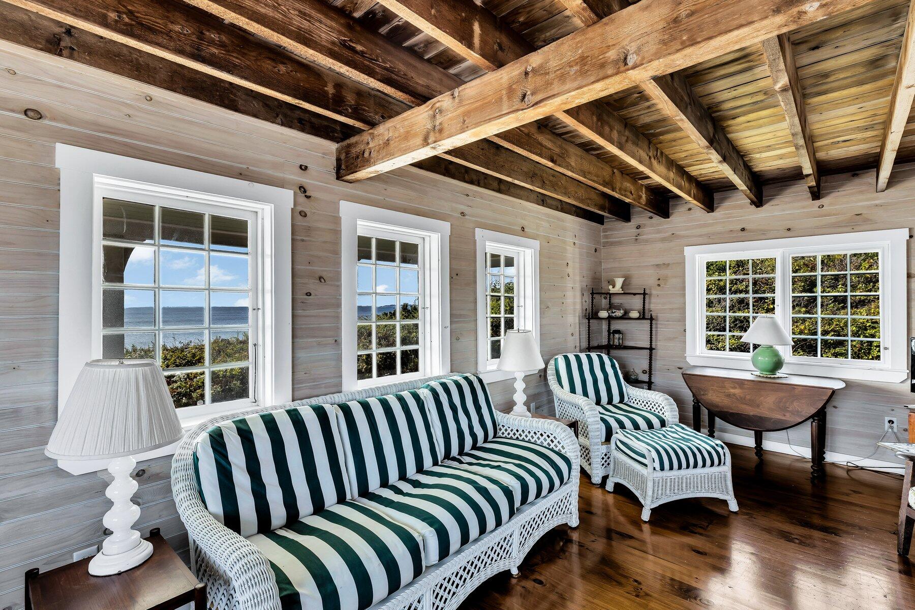 6 Bay View Path Truro, MA 02666 - Photo 37 of 57 a view of a porch with furniture and wooden floor