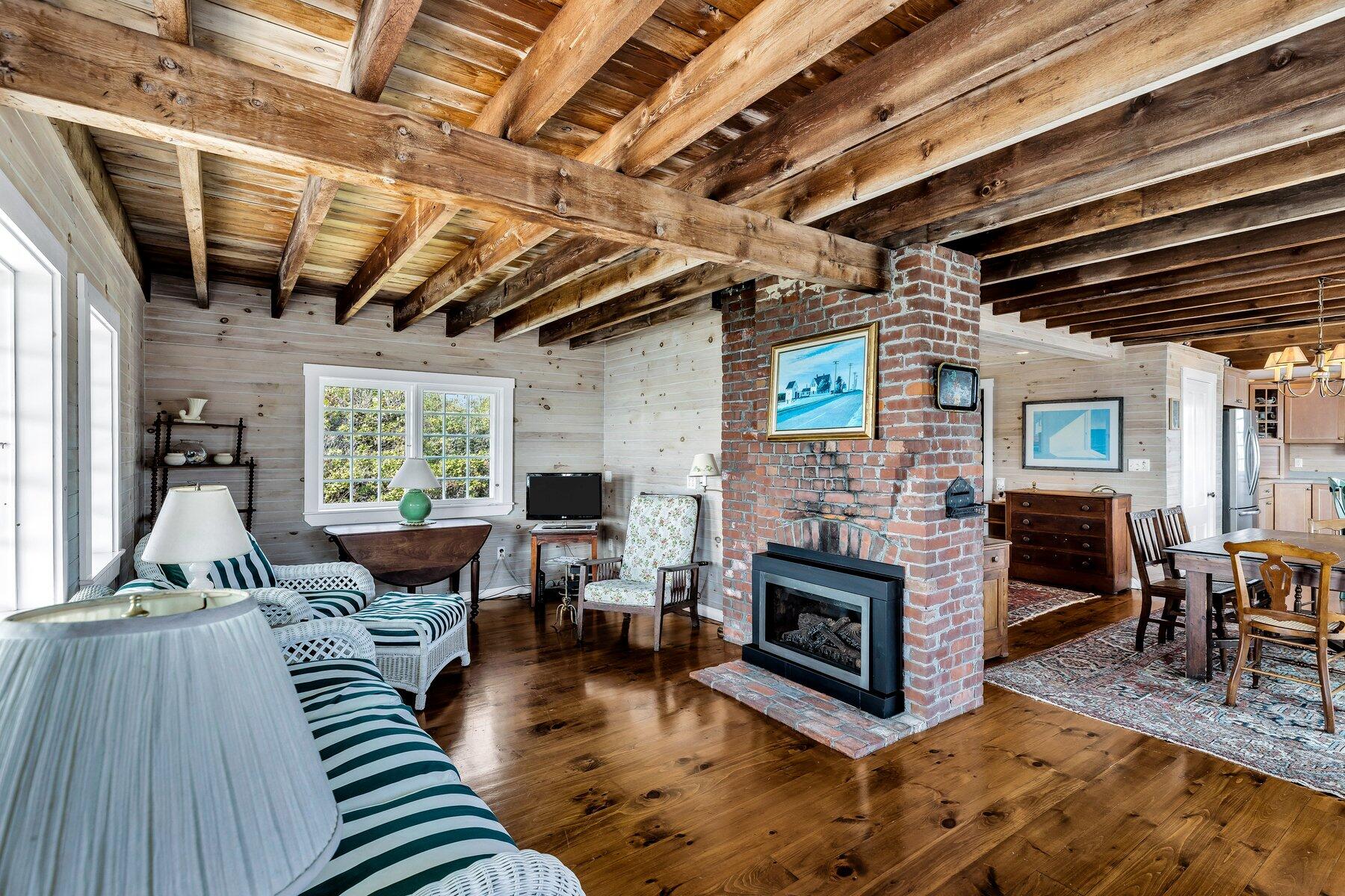 6 Bay View Path Truro, MA 02666 - Photo 38 of 57 a living room with furniture and a fireplace