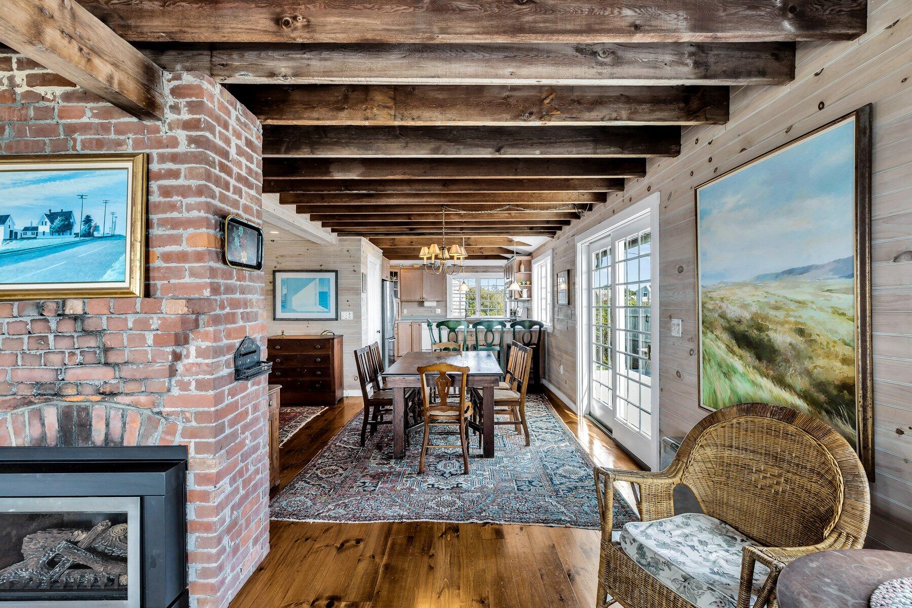 6 Bay View Path Truro, MA 02666 - Photo 39 of 57 a living room with furniture and a fireplace