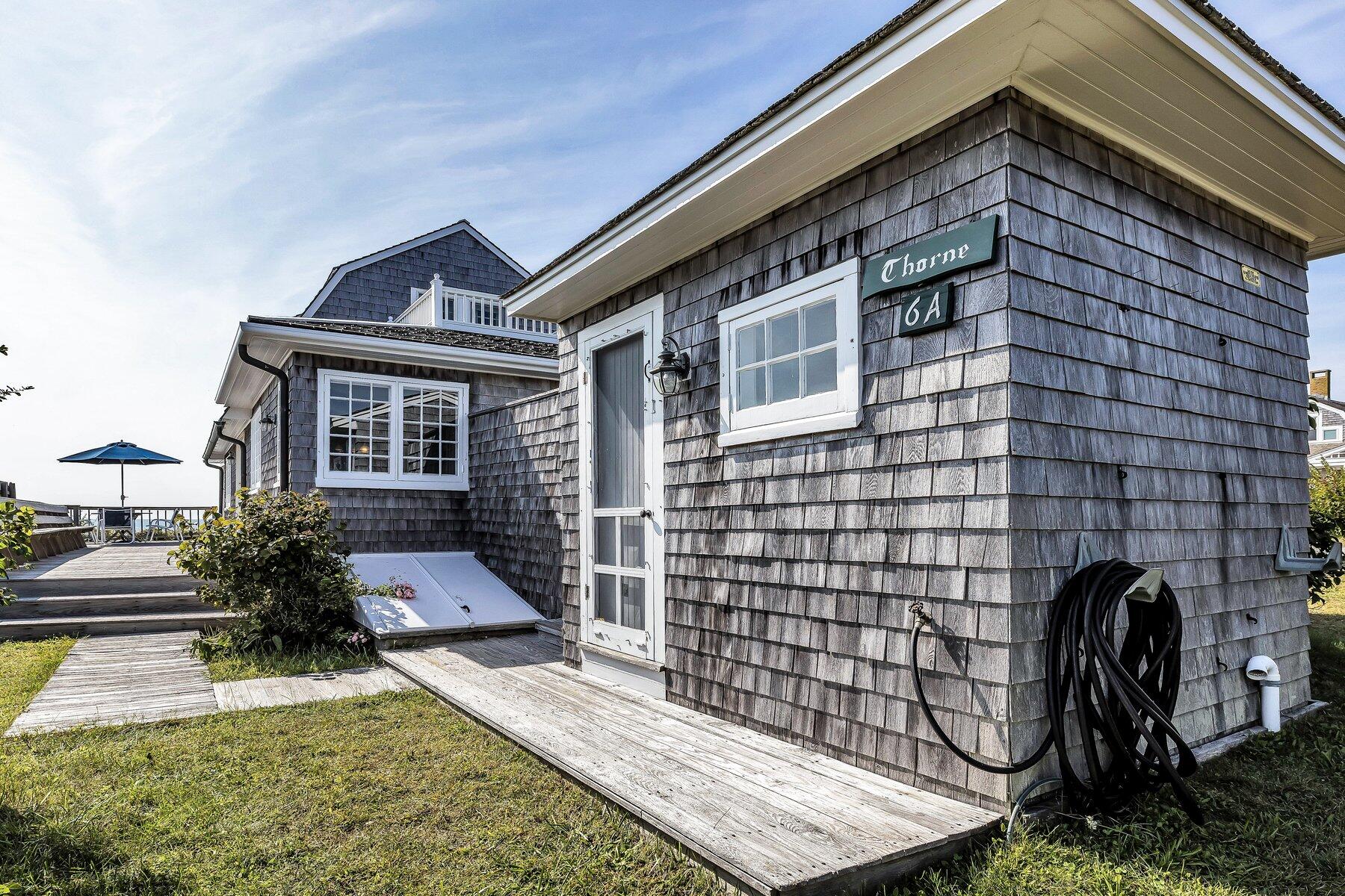 6 Bay View Path Truro, MA 02666 - Photo 45 of 57 a front view of a house with a garden