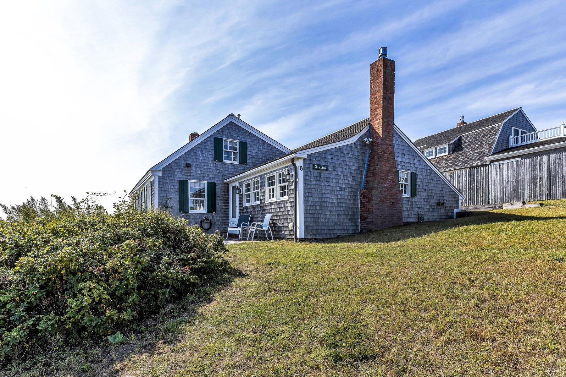 6 Bay View Path Truro, MA 02666 - Photo 9 of 57 a view of a house with a wooden fence