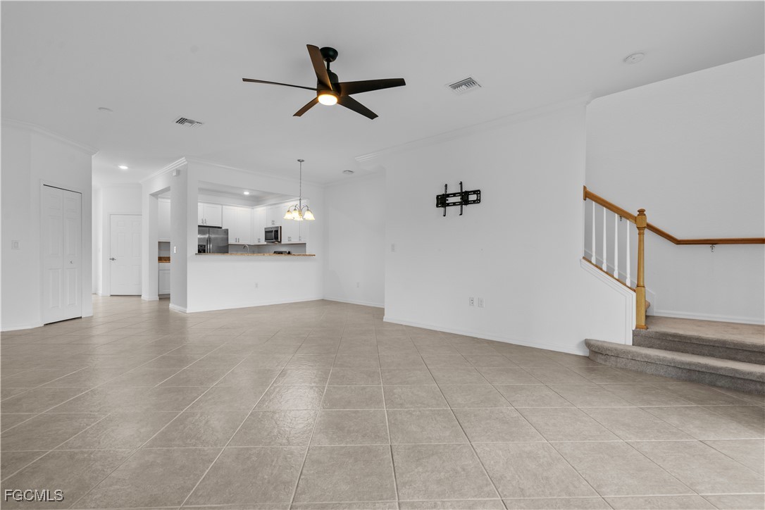 12557 Westhaven Way Fort Myers, FL 33913 - Photo 11 of 24 a view of a livingroom with a ceiling fan a ceiling fan and kitchen view