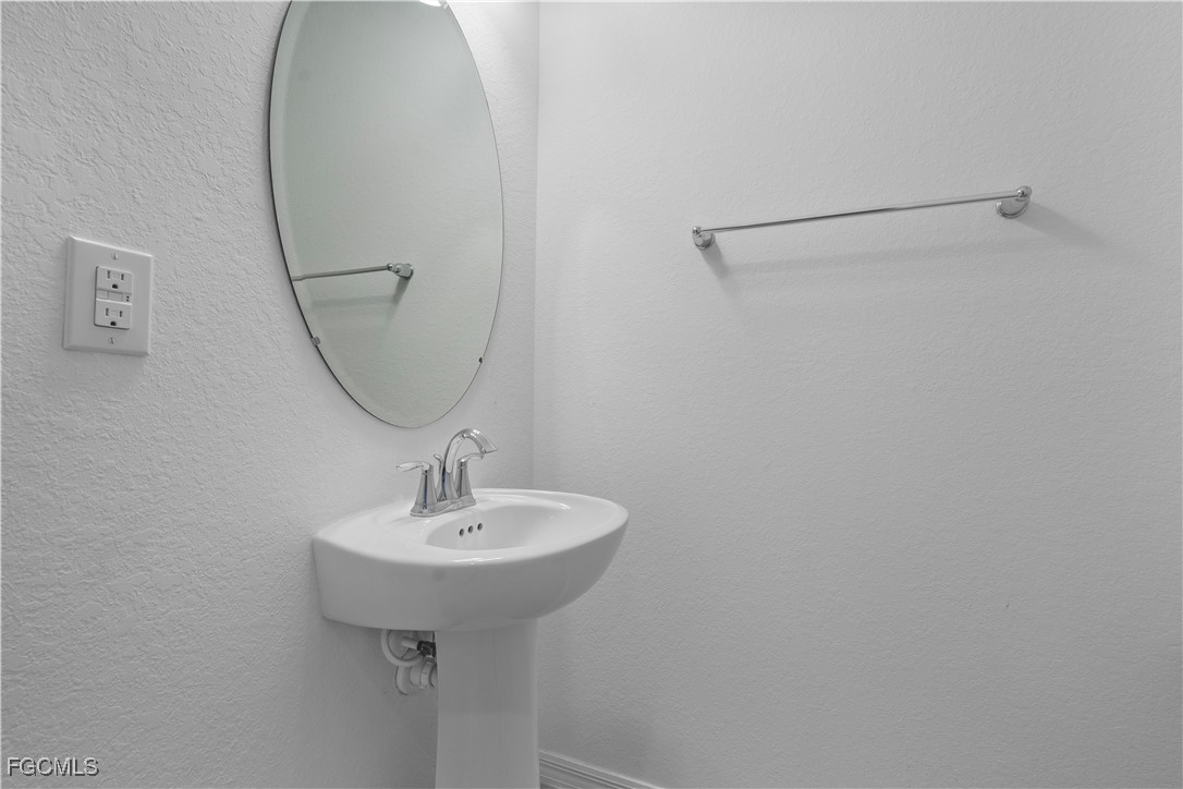 12557 Westhaven Way Fort Myers, FL 33913 - Photo 15 of 24 a bathroom with a sink and a mirror