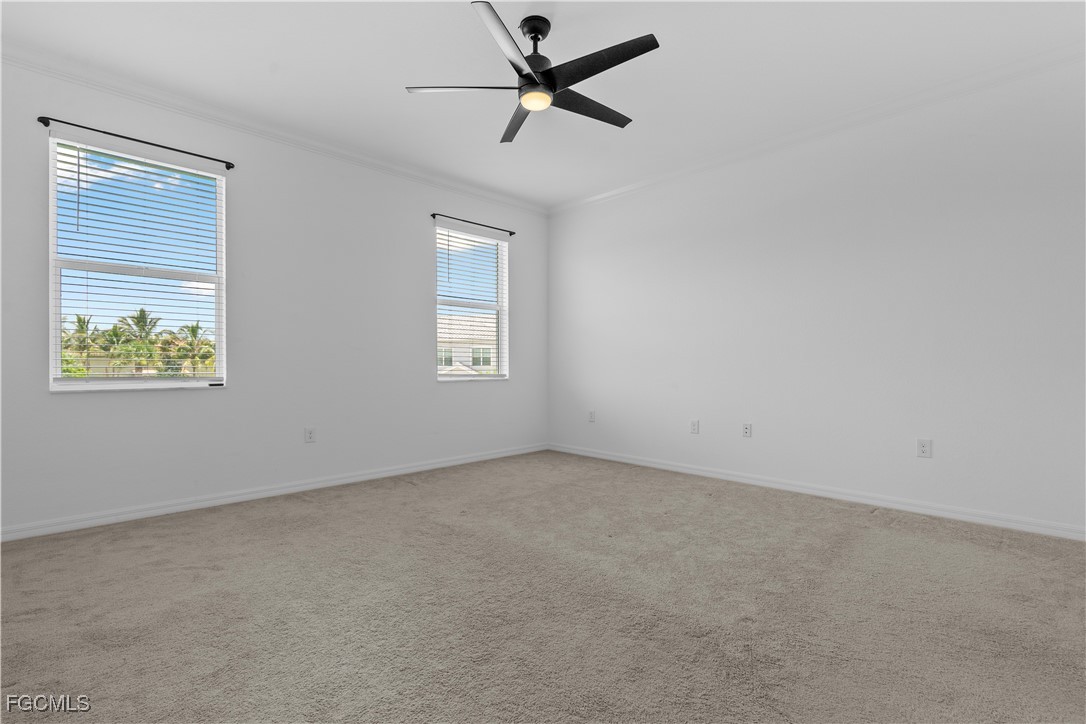 12557 Westhaven Way Fort Myers, FL 33913 - Photo 16 of 24 an empty room with windows and fan
