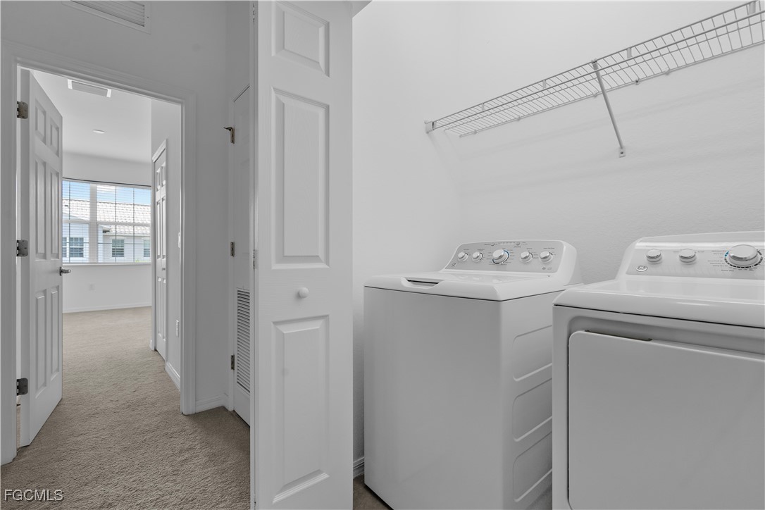 12557 Westhaven Way Fort Myers, FL 33913 - Photo 19 of 24 a utility room with dryer and washer