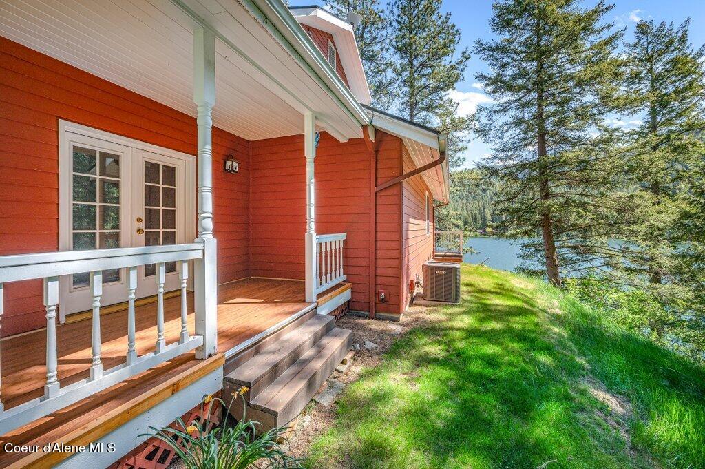 63200 South Powderhorn Bay Road Harrison, ID 83833 - Photo 17 of 64 Covered front porch with new flooring