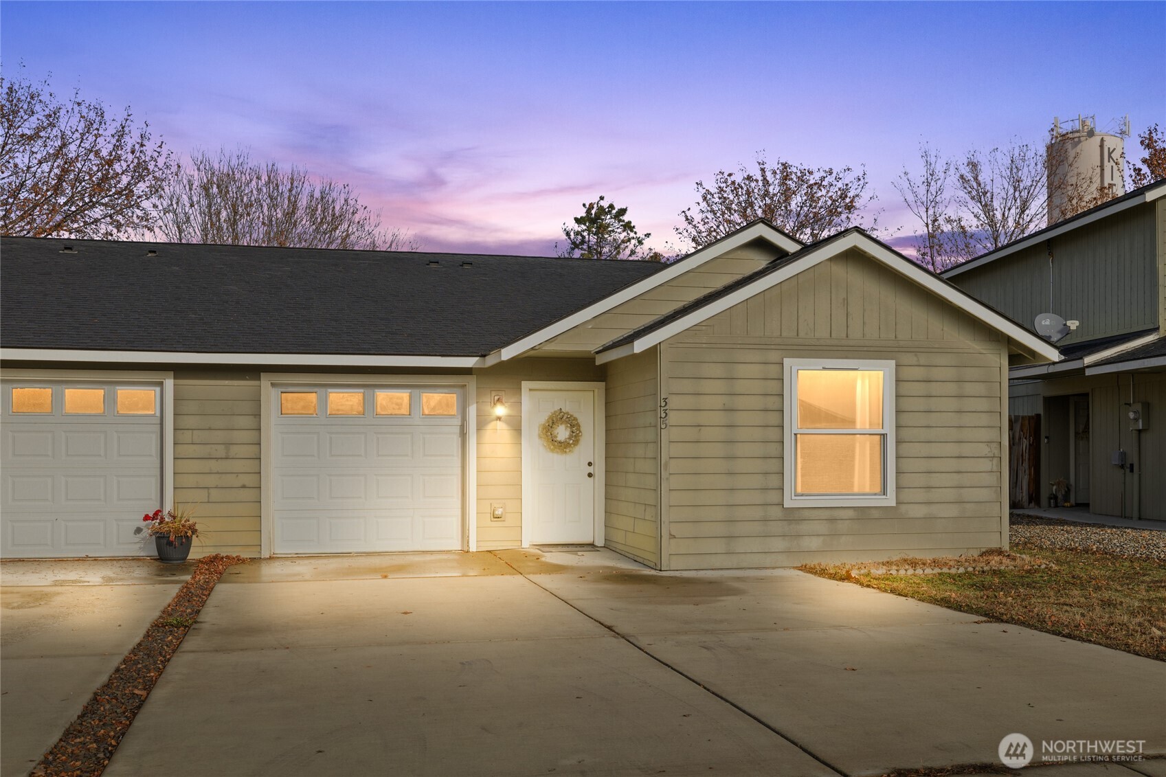 335 Pacific Loop Kittitas, WA 98934 - Photo 1 of 39 a front view of a house with a yard and garage