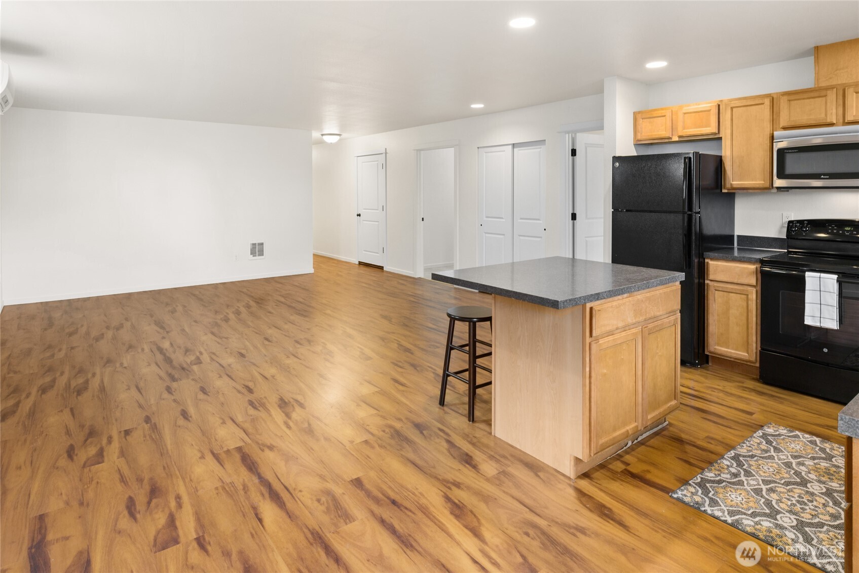 335 Pacific Loop Kittitas, WA 98934 - Photo 14 of 39 a kitchen with stainless steel appliances kitchen island granite countertop a refrigerator oven a sink and dishwasher