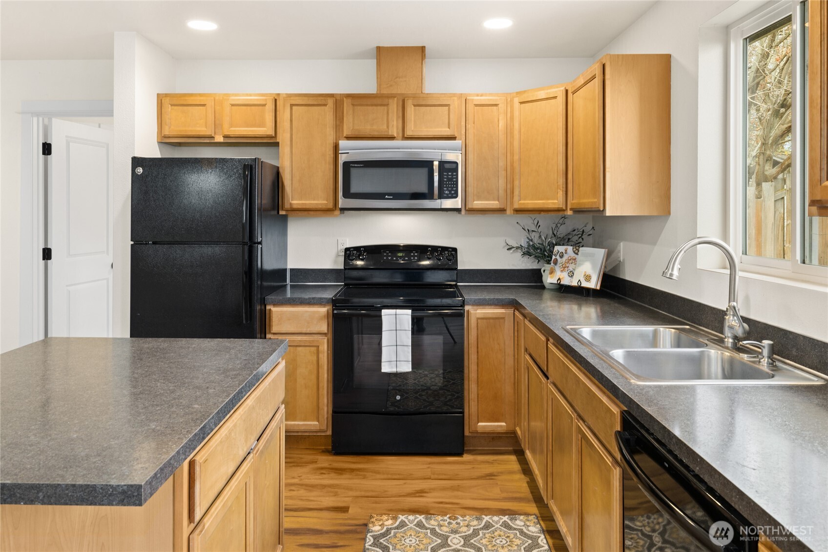 335 Pacific Loop Kittitas, WA 98934 - Photo 17 of 39 a kitchen with stainless steel appliances granite countertop a sink a stove and a refrigerator