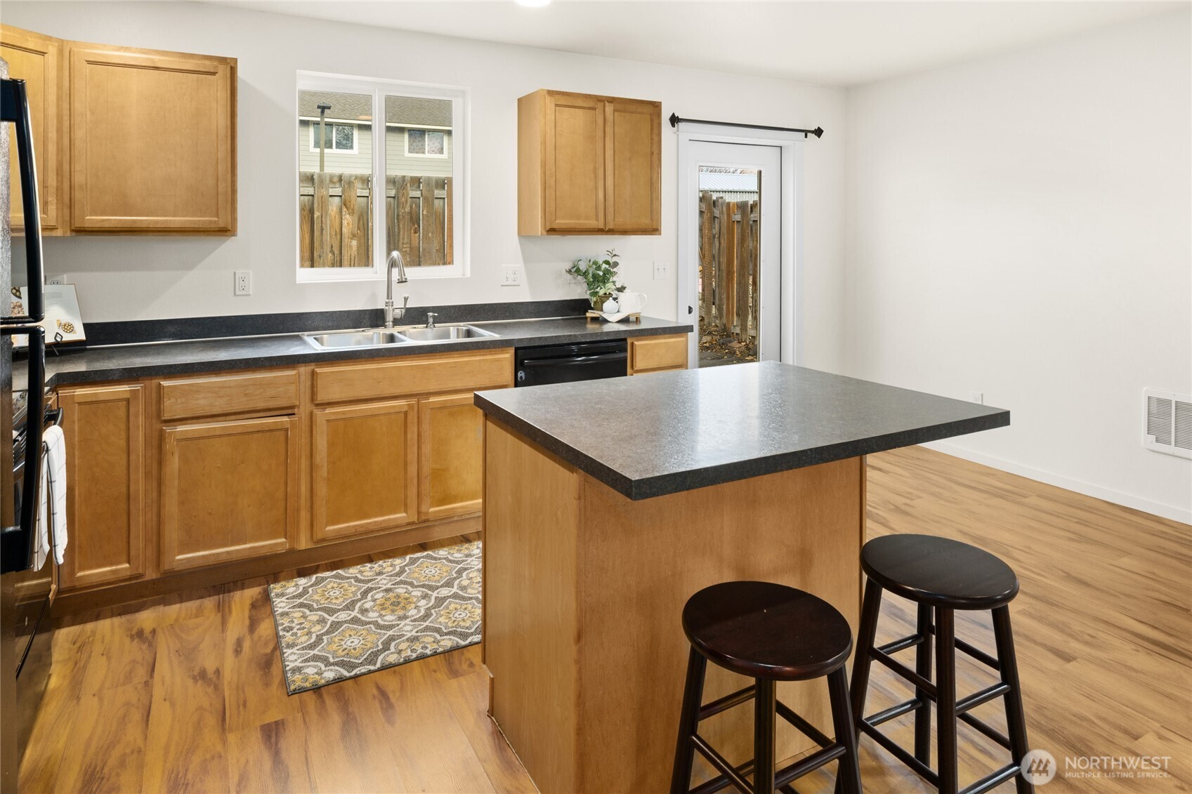 335 Pacific Loop Kittitas, WA 98934 - Photo 19 of 39 a kitchen with a table chairs and a refrigerator