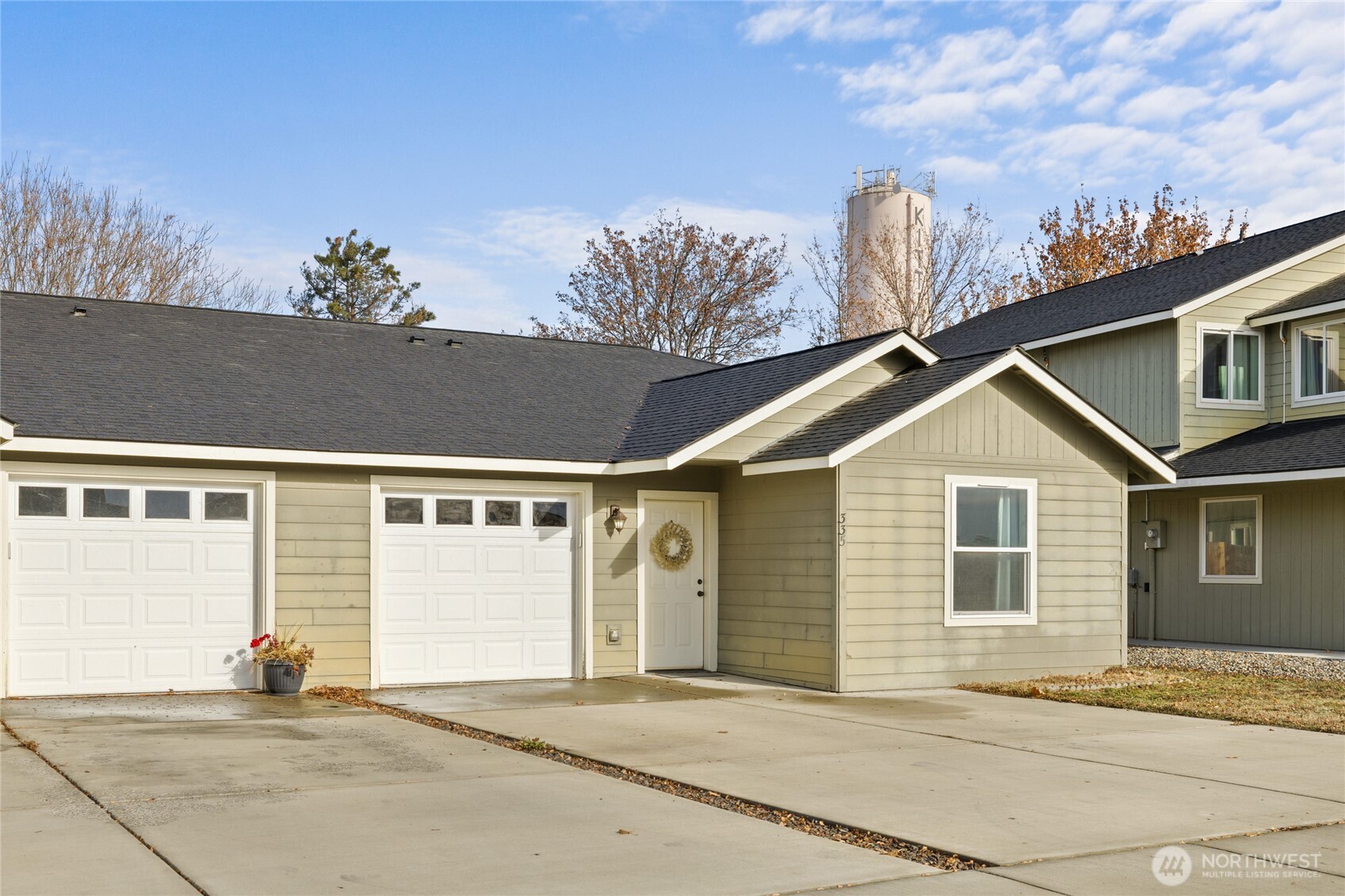 335 Pacific Loop Kittitas, WA 98934 - Photo 32 of 39 a front view of a house with a yard and garage