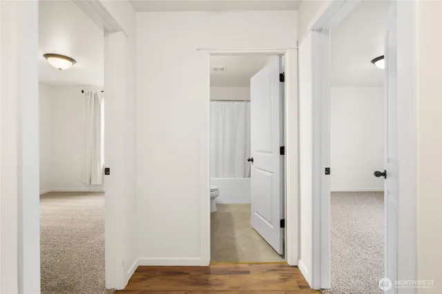 a view of a bathroom from a hallway