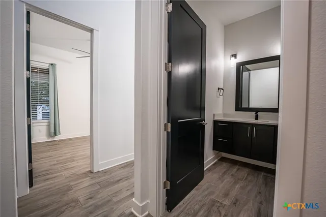 a bathroom with a toilet sink and a mirror