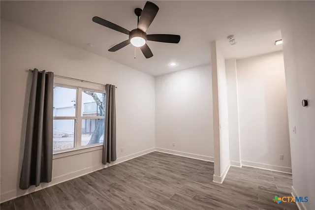 a view of staircase with rug