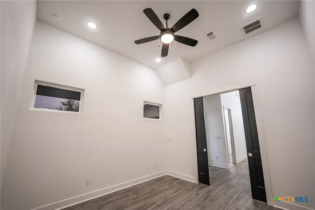 a kitchen with a refrigerator and a sink