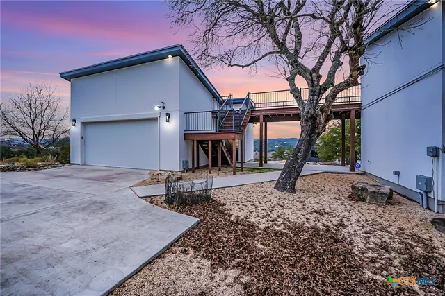 a view of a balcony with wooden floor and city view