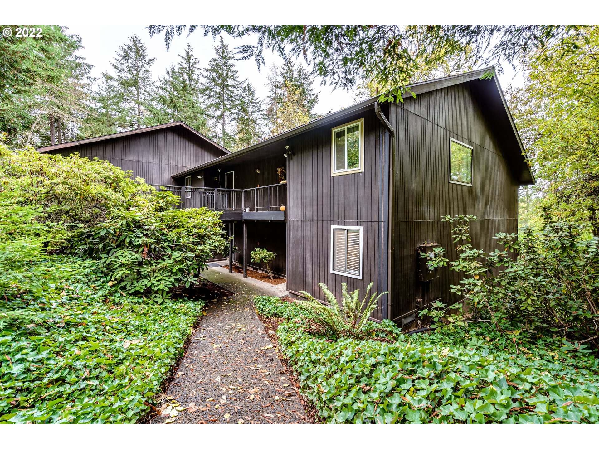 a backyard of a house with lots of green space