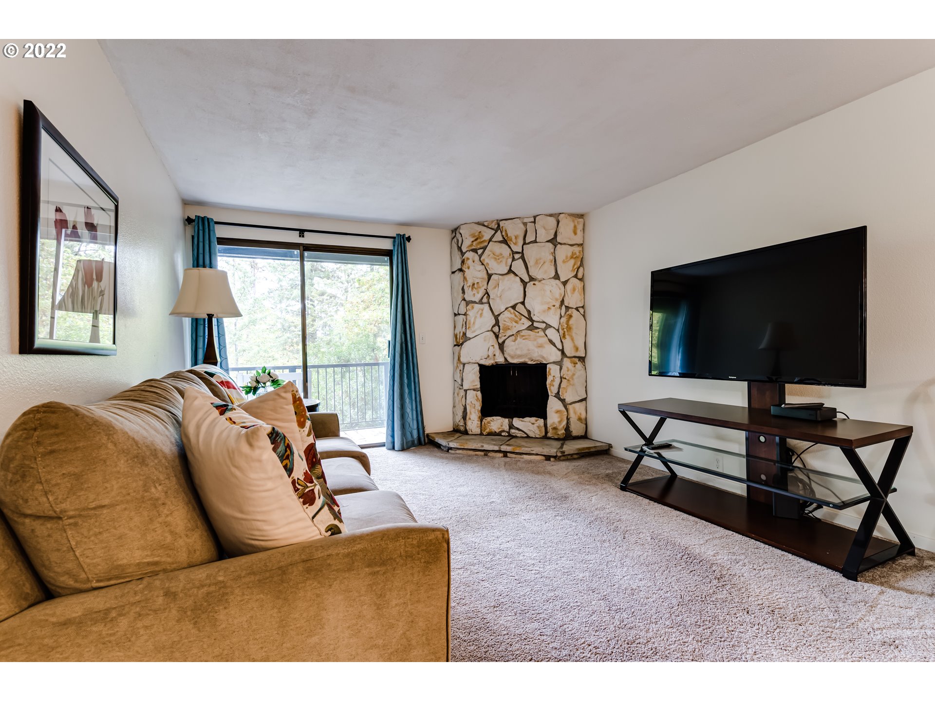 2695 Woodstone Place Eugene, OR 97405 - Photo 13 of 23 a living room with furniture and a flat screen tv