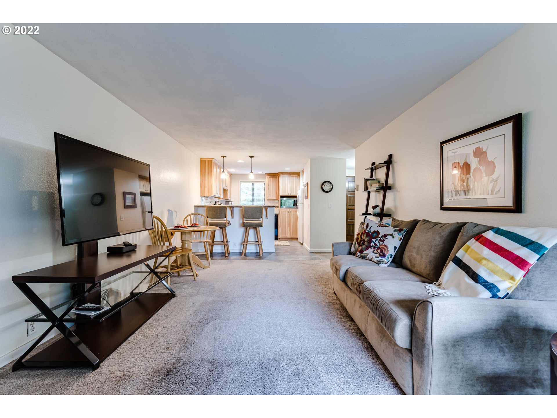 2695 Woodstone Place Eugene, OR 97405 - Photo 14 of 23 a living room with furniture and a flat screen tv