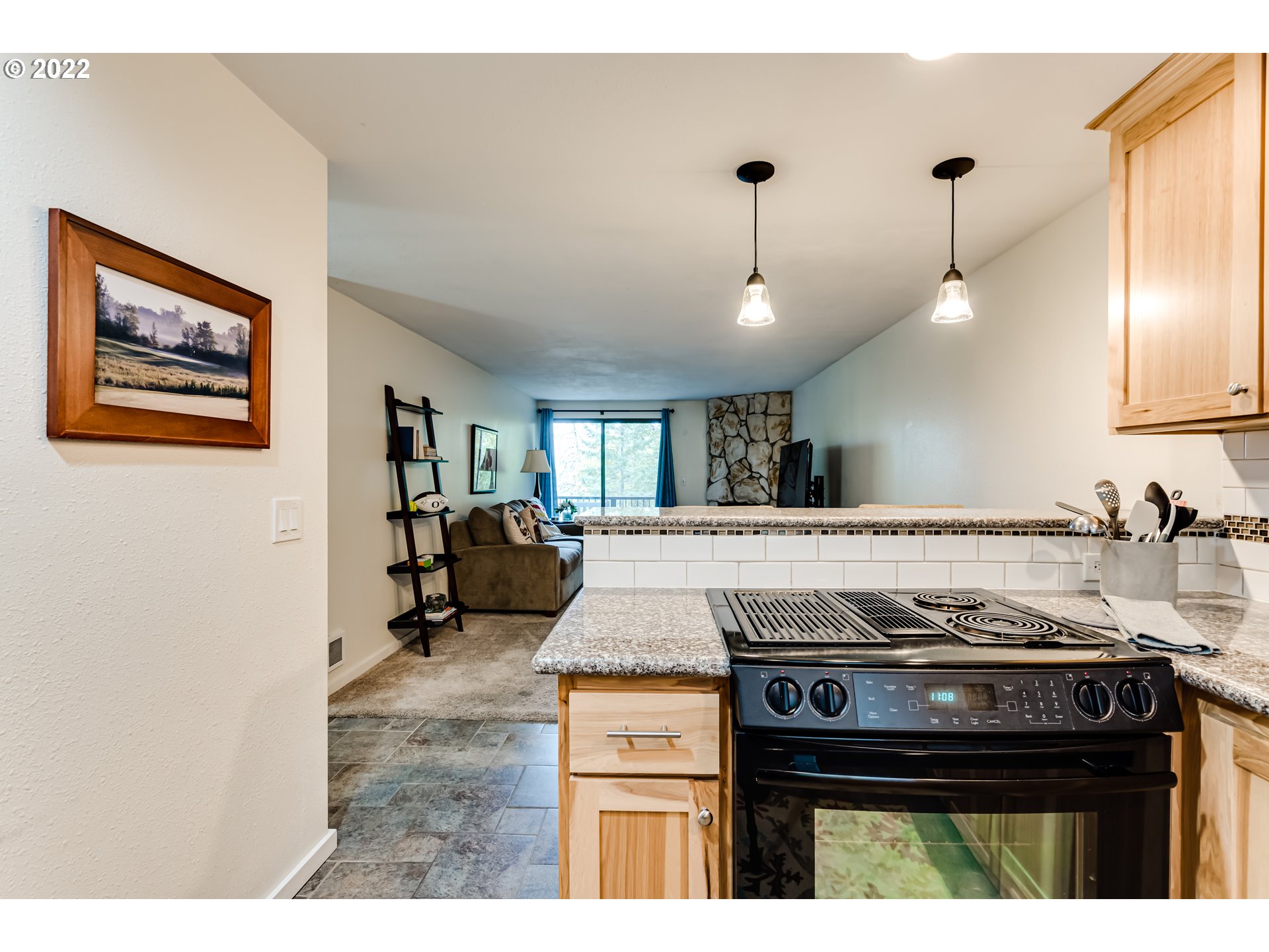 2695 Woodstone Place Eugene, OR 97405 - Photo 8 of 23 a kitchen with a stove and a sink