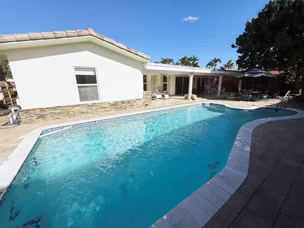 a front view of house with yard and seating area