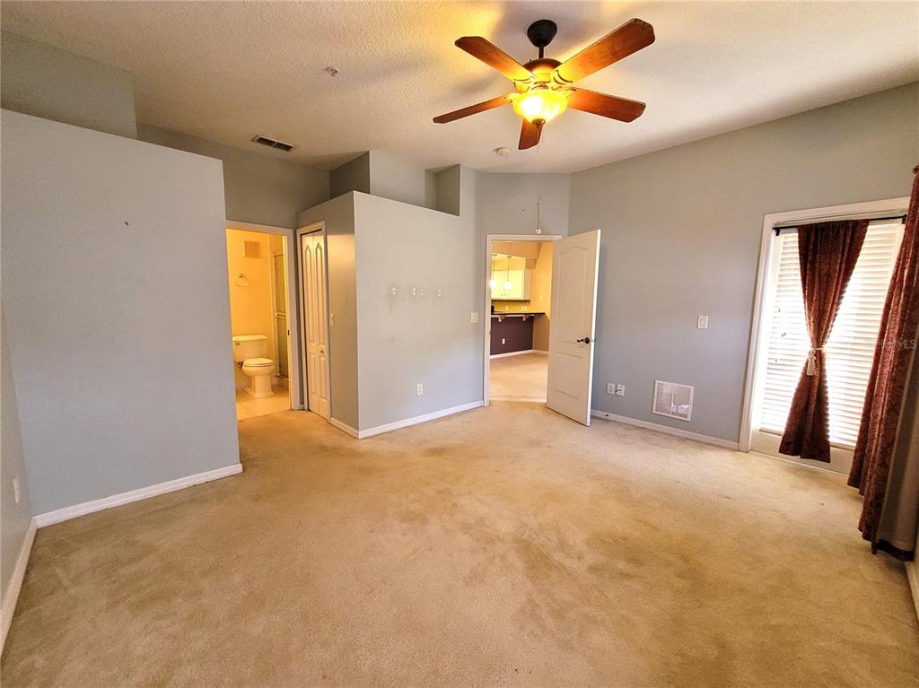 673 Sandy Neck Lane, Unit 101 Altamonte Springs, FL 32714 - Photo 16 of 39 an empty room with closet and a ceiling fan